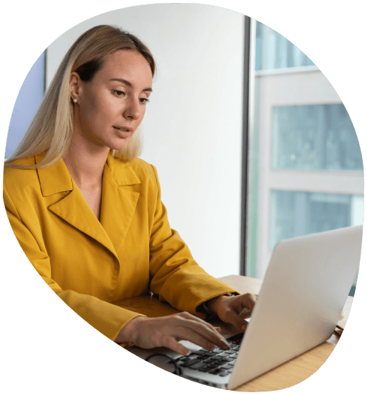 A translator sends a rush file from a laptop, delivering it to Alexandria Translation with accurate 24/7 support.