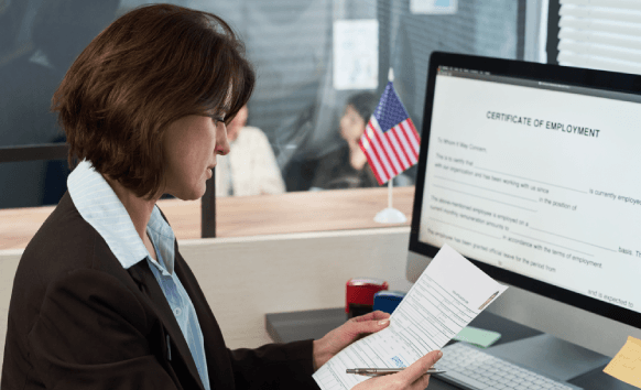 A certified translator stamps a completed birth record translation, showing Birth Certificate Translation Services.