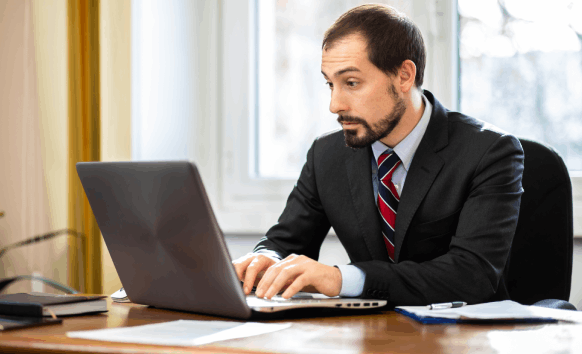 Translator providing fast translation services in Ontario while a client reviews accurately translated docs for business use.