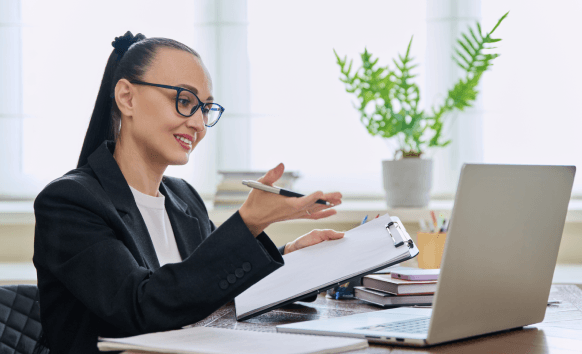 A translator compares source text and certified translation on dual monitors, reflecting Accurate Translation Services.