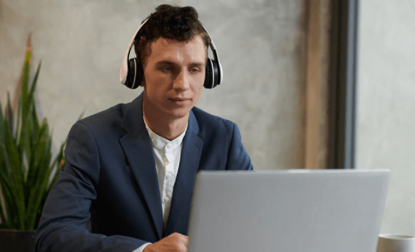 A project manager reviews an affordable quote for Navajo Transcription Services on a laptop, matching budget and deadline.