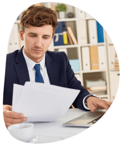 A certified translator in Alexandria reviews a document on a laptop, representing Alexandria Translation for local clients.