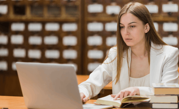 A typist using advanced tools for Book typing services, converting hardcopy books into accurate digital formats quickly.