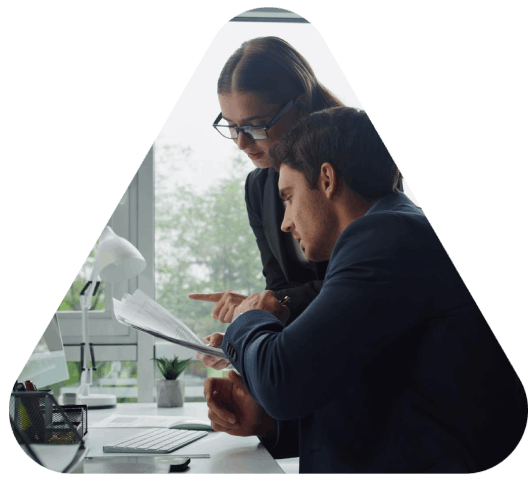 A project manager reviews a contract and brand guide as Manchester Translation Services handles business document.