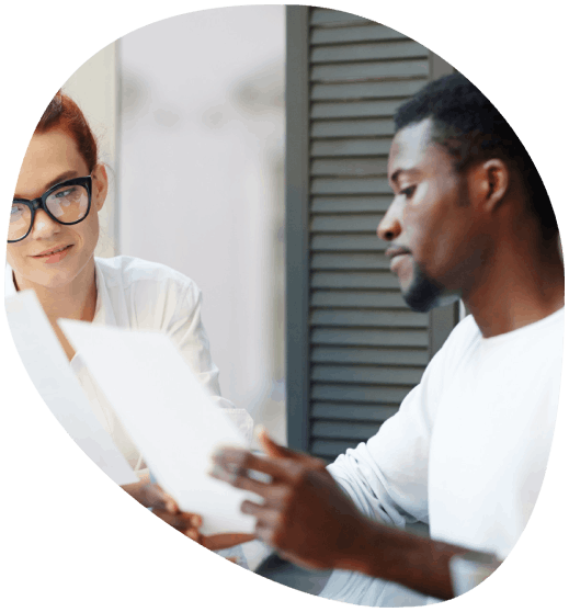 A sales lead revises a translated proposal as Manchester Translation Services supports business bids for global partners.