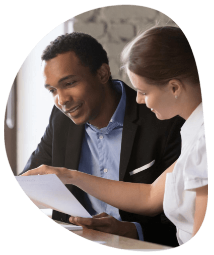 A managers reviews bilingual contract drafts as Toledo Translation Services supports business approvals and version control.