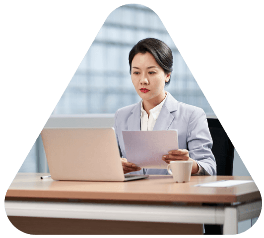 A certified linguist reviews chemical assay tables in a lab, delivering Pharmaceutical Translation with verified accuracy.