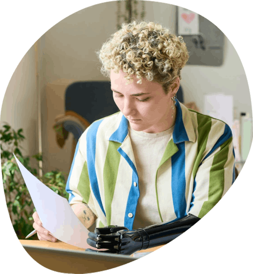 A coordinator reviews certified multilingual flyers as Green Bay Translation Services prepares consistent messaging.