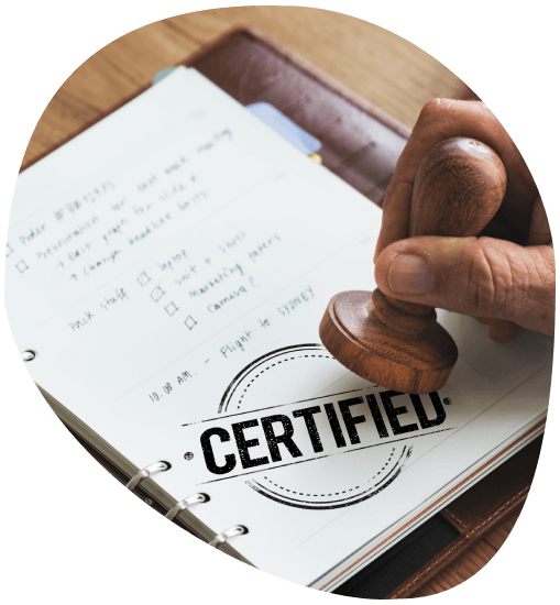 Certified translator stamps a signed contract translation, highlighting Translation in Naperville for certified translations.