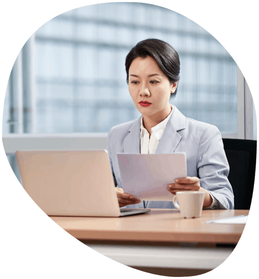 A certified translator checks medical records on a screen, providing precise Translation Services in Chattanooga.