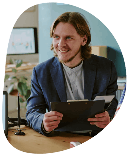 A project manager checks names and dates as Manchester Translation Services completes certified USCIS immigration.