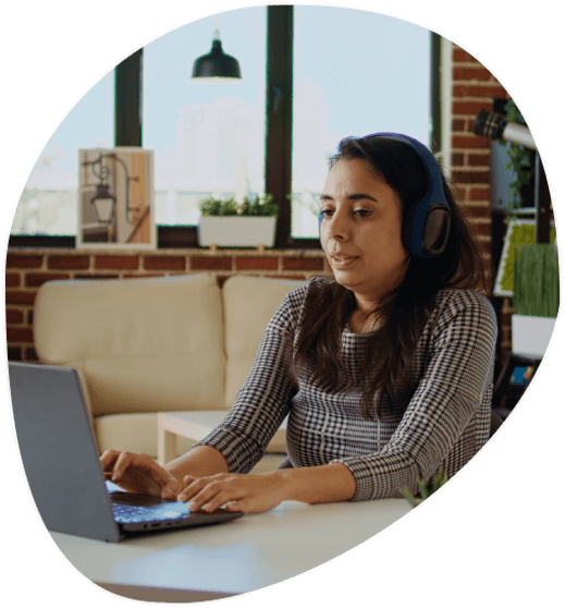 A specialist timestamps a webinar recording on a laptop, providing Media Transcription Services with comprehensive.