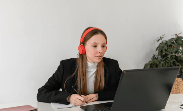 A transcriptionist types audio into a secure portal, delivering Portuguese Transcription Services with confidential handling.