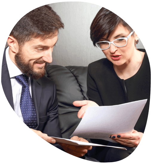 A manager compares bilingual contract clauses as Boise Translation Services delivers business document translation.