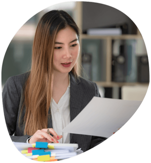 A translator in Stamford sorts medical reports, resumes, and handwritten pages for Translation Services in Stamford.