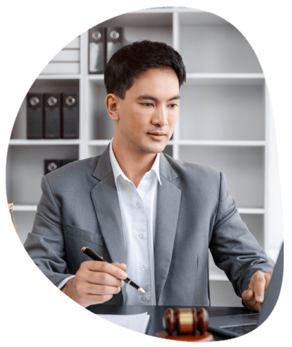 The lawyer reviews a legal contract packet in an office, using Expert Translation Services in Columbia, Missouri.