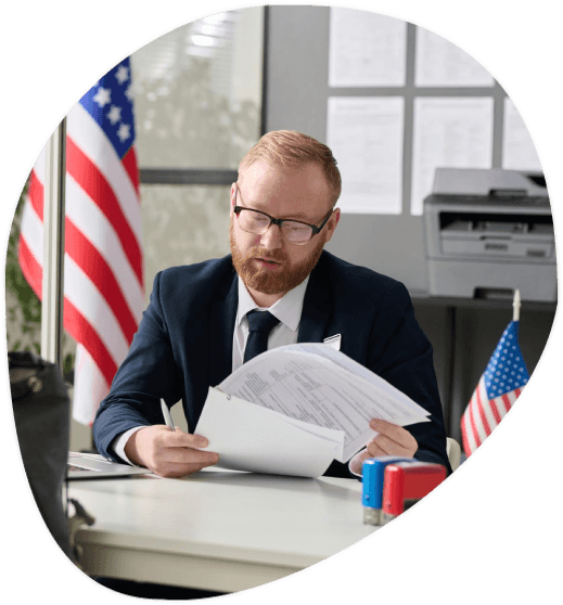 A coordinator preps USCIS packets with certified translations at Allentown Translation Services for immigration filings.