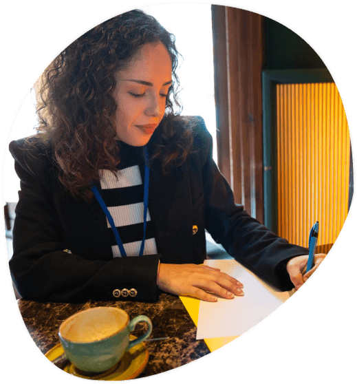 A translator checks an immigration packet for USCIS, and Toledo Translation Services matches names, dates, and seals.