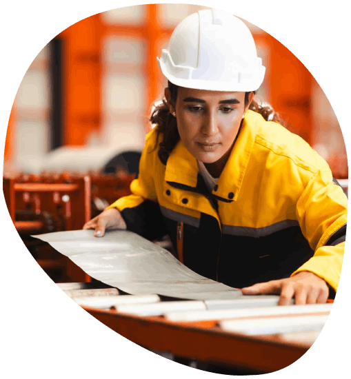 An engineer checks a bilingual spec sheet as Green Bay Translation Services completes industry-specific terminology.