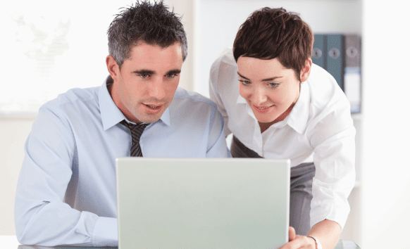 Business professional working with a translation expert to get reliable Midland translation services.
