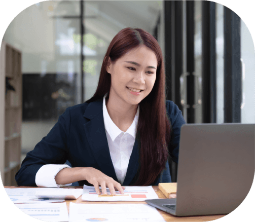 A translator reviews a multilingual language list, showing how Alexandria Translation Services supports over 100 languages.