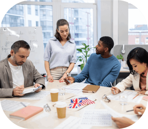 A multilingual team reviews a document together in an office, delivering Translation Services in Fargo with native-language.