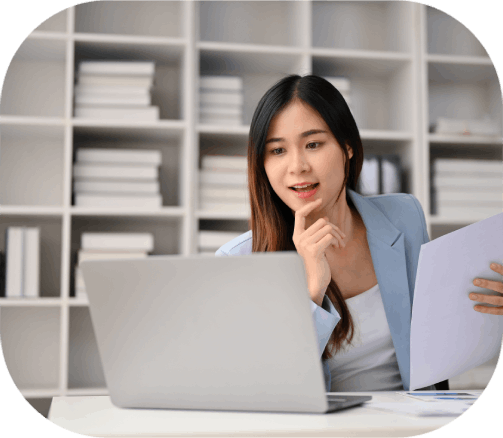 Translator delivering multilingual translation in Ontario while a client reviews documents translated into several languages.