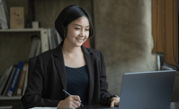 A native translator edits a business letter at a desk, showcasing Alexandria Translation Services' native translators.