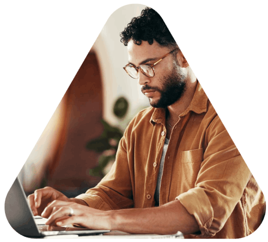A translator compares source and target pages on dual monitors during 24 Hour Translation Services for time-sensitive.