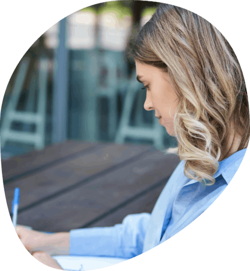 A project lead sorts personal IDs and corporate decks as Manchester Translation Services handles personal-corporate needs.
