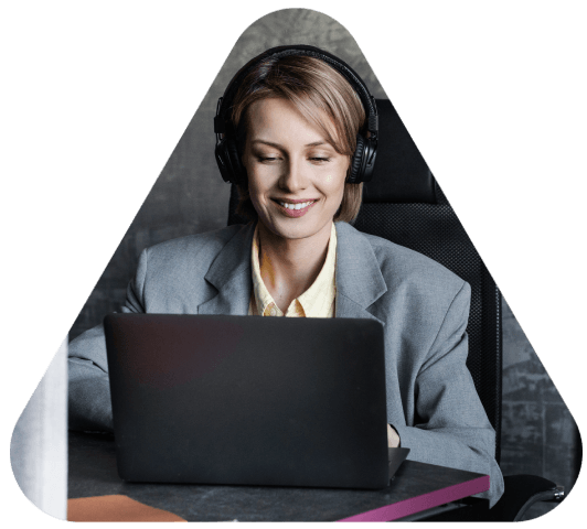 A transcriptionist types court testimony from a recording, delivering Portuguese Transcription Services for legal hearing.