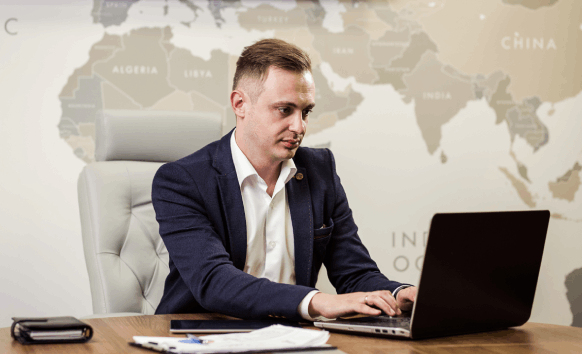 A native-speaker linguist delivers Translation Services in Wichita at a desk, checking terminology and tone.