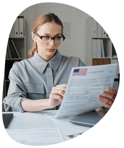 A linguist proofreads a formatted contract for Winston Salem Translation Services document review before secure delivery.