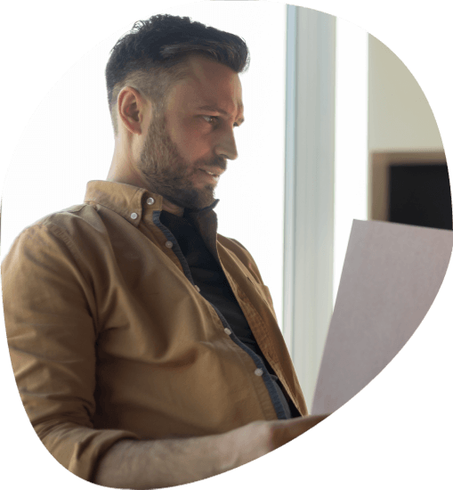 A client reviews a Spanish-to-English draft with a Spanish native translator, reflecting Accurate Translation Services.