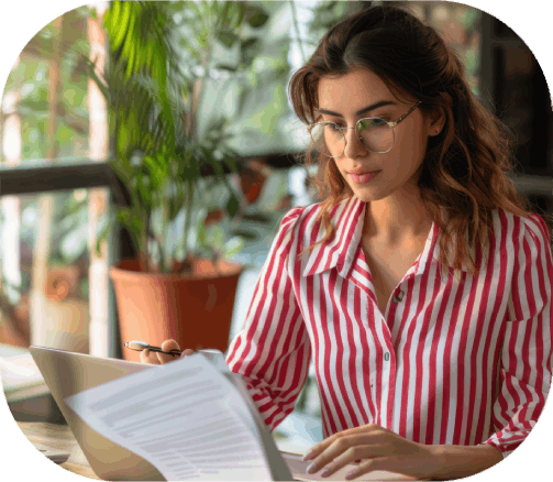 A native Spanish linguist edits a product manual at a desk, delivering Translation Services in Wichita for local companies.