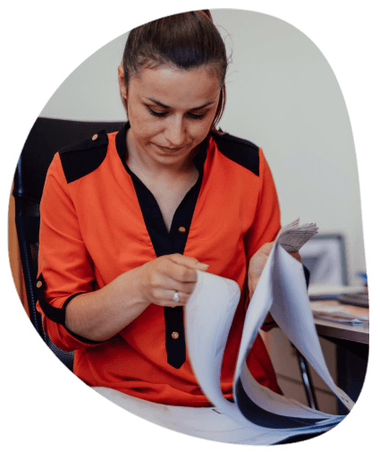 An engineer checks a bilingual user manual as Allentown Translation Services completes technical translation for safe use.