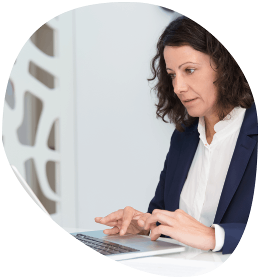 A typist using advanced technology to provide affordable typing services, ensuring accuracy and quick delivery for clients.