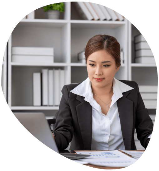 A certified translator checks an official document at a desk, showcasing Translation Services in Norfolk for verification.