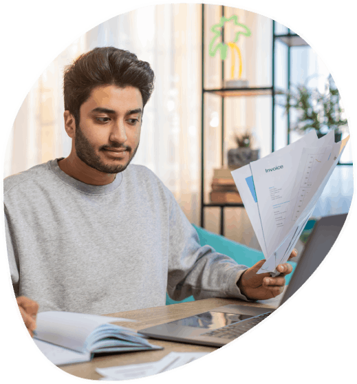 A client reviews a certified immigration translation packet at a desk, using Translation Services in Fargo for USCIS filing.