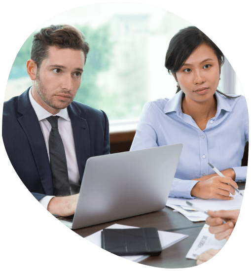 A recruiter reviews online translator applications on a laptop, hiring for Translation Services in Stamford and nearby areas.