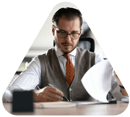 A client signs an NDA at a desk before Translation Services in Wichita begin, protecting confidential document translation.