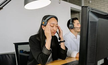 A translator listening to an audio file and translating it