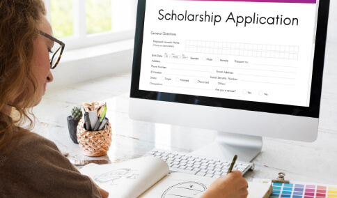 A student filling a scholarship application for university