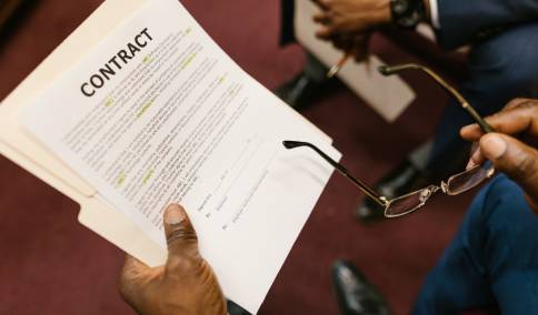 Man holding contract papers