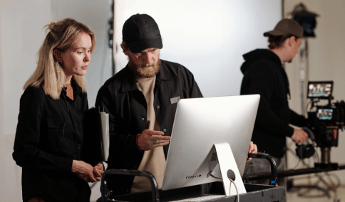 Film producer benefiting from synchronized dubbing provided by skilled translators through movie translation services US.