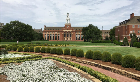  A sprawling garden with the University of Oklahoma in the background