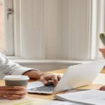A professional transcriber working on a book to translate without compromising quality